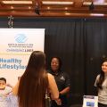 Boy and Girls Club Agency Booth talking to Social Work Students
